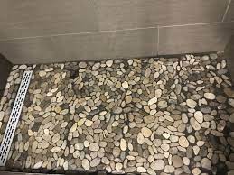 All about pebble shower floors and why, despite their popularity, they are not the best choice for a shower floor or your bathroom renovation. Problems With Shower Drain With Pebble Floor