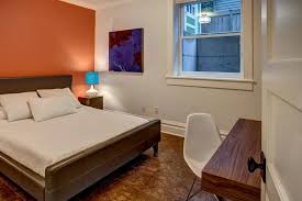 A moroccan style bathroom with an. White Basement Bedroom Features Orange Accent Wall Hgtv