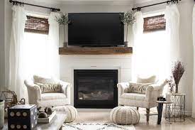 Also know, can you put shiplap around fireplace? Shiplap And Barn Beam Fireplace Mantel Makeover