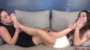 Brunette lesbians Cleo and Sophie Reyes licking each others feet on the  sofa - Feet9