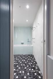 A clever mixing of white marble mosaic tile, white marble countertop, and white and gray leaf wallpaper gives this beautiful bathroom by jennifer worts design a peaceful sense of harmony. Best 60 Modern Bathroom Marble Floors Design Photos And Ideas Dwell