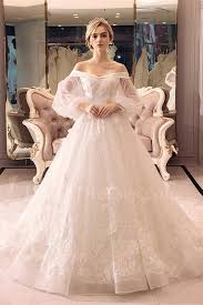 In some cases, it can seem like the bride is floating within a soft cloud of rustling fabric. Ball Gown Off The Shoulder Long Sleeve Crystal Beaded Lace Tulle Wedding Dress Ball Gowns Wedding Ball Gown Wedding Dress Wedding Dresses