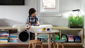 The simple little couch is surrounded by big fluffy poofs and pillows that are perfect for nap and quiet time. How To Design A Play Space You Your Kids Will Love House Home