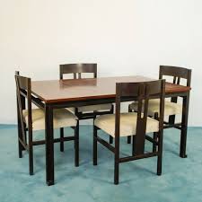 Full kitchen dining set featuring four chairs and a table. Dining Table Chairs Set By Angelo Mangiarotti 1960s Set Of 5 For Sale At Pamono