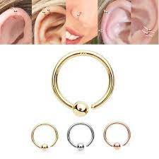 Clamp the haemostats on the bar to keep it from spinning and twist the ball with your hand (lefty loosey, righty tighty). 14k Gold Fixed Ball Hoop Nose Cartilage Eyebrow Daith Rook
