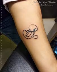 A Letter With Heart Ink Need Tattoo Alphabet Tattoo Ravi Chauhan Tattoo Lettering Styles Alphabet Tattoo Designs Feather Tattoos