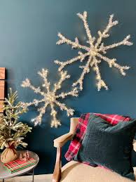 After doing some shopping at walmart, i found some really neat foam snowflake shapes and well, this is what i decided to do with them! Make Oversized Light Up Snowflake Holiday Decorations From Wire Hangers Hgtv