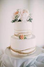 Rustic Twine Wrapped Buttercream Cake With Peach And White Flowers Sophie Baker Wedding Cake Buttercream Rustic Wedding Cake Rustic Buttercream Wedding Cake