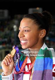 Reuben Ross and Alexandre Despatie of Canada pose with the gold... News  Photo