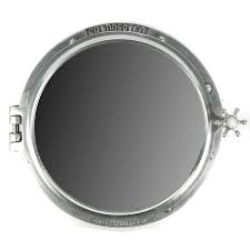 You can mount the cabinet on the wall and use it as a mirror above the bathroom sink. Chadder Co Porthole Mirror Cabinet Ebth