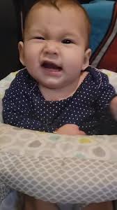 What is she trying to do? She looks like she has a major tickle