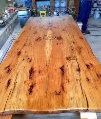Pecan Wood Table With A Star Emblem Engraved In The Center Created By Hahn Hahn Sawmill And Woodworking Pecan Wood Custom Wood Furniture Wood Furniture