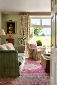 An animal hide rug on a vibrant pink oriental rug adds eclecticism. 10 Fantastic English Country Living Rooms You Must See