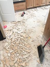 Don't beat yourself trying to remove tile by hand if you don't have to. How To Remove Tile Flooring Yourself With Tips And Tricks All Things Thrifty
