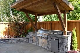 We are your contractor for custom pavilions and pergolas in tulsa. Rustic Patio With Polished Concrete Outdoor Kitchen Raised Beds Stacked Stone Fence Exterior Stone F Rustic Outdoor Kitchens Rustic Patio Backyard Kitchen