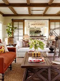 Blue decorative accents enhance the cooling color scheme that is offset by warm tones of yellow and red. 43 Cozy And Warm Color Schemes For Your Living Room