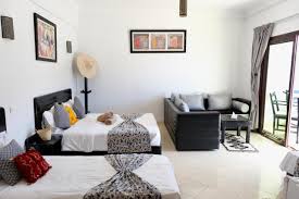 A bright triple room with a private balcony.