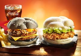 Mcdonald S Japan New Orange And Black Halloween Burgers The Squid Ink Burger Features Black Sesame Buns Cheddar Cheese Two Beef Pa Food Burger October Food