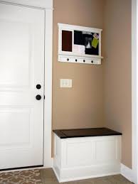Anchoring the space is a gorgeous, oversized mirror reflecting the lovely living room. Entryway Bench Ideas For Small Spaces