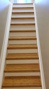 Basement Stairs Dressed Up With Bamboo Hardwood Flooring White Paint On Risers Apartment Stairs Stairs Trendy Home