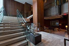 Four Seasons Hotel Toronto Features A Mix Of Earthy Textures Sleek Glass And Woven Gilded Structures That Co Interior Staircase Staircase Design Modern Hotel