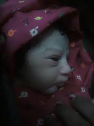 This is my first photo of my daughter, she is 12 now but this picture holds  a special place in my heart! Can someone please make it more clear!  Thankyou so much ❤️