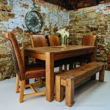 Distressed wood doesn't sound like a great aesthetic choice, but it is quite a fetching addition if you want a rustic theme. Wooden Dining Table Plank Dining Table Curiosity Interiors