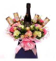 Creating warm, beautiful flower arrangements wrapped elegantly and delivered to a location of your choosing. Alcohol Gifts Alcohol Hampers Alcohol Chcolate Bouquets