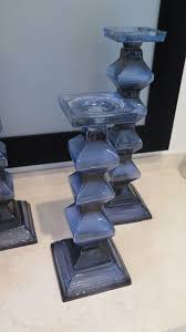 With its unique shape and bright color this candle holder is sure to attract attention. 4 Blue Glass Pillar Candle Holders Oahu Auctions