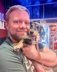 No offense but if you remove me (the long-haired dapple dachshund) from  these pics... it's just some guy 🤭 Congrats