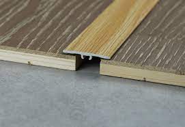 The moldings create aesthetically pleasing transitions between drywall and acoustical. China Aluminium Strips Metal Edged Trim T Shaped Floor Transition Bronze Metal Tile Trim China Flooring Profile Flooring Accessory