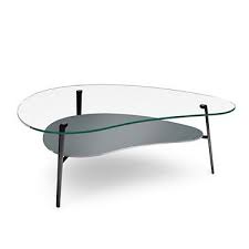 The ambiance is casual with an eclectic decor. Picture Of Comma Coffee Table Coffee Table Table Furniture