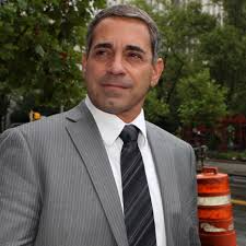 Sobbing ex-cop sentenced to nearly 5 years in gun smuggling