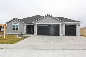Black And White House With Wood Garage Door Idx Search From Century 21 Tri Cities Com Gray House Exterior House Designs Exterior Outdoor Remodel