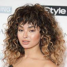 Even if you don't have enough length to work with you can still get the best. How To Style Curly Bangs Without Looking Like A Flashdance Reject Allure