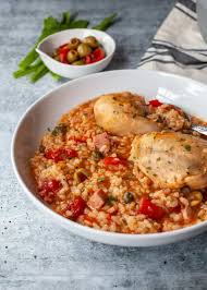 Puerto rican rice is a yellow rice recipe where the rice is cooked in a sauce mixture called sofrito and takes on a yellow coloring through the spices in either sazon seasoning, turmeric, or through using annato oil. Asopao De Pollo Puerto Rican Chicken And Rice Soup The Noshery