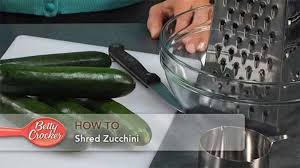 While each of these recipes explains how to properly prepare the zucchini, the majority of them call for shredding two medium zucchinis on the large holes of a box grater. How To Shred Zucchini Bettycrocker Com