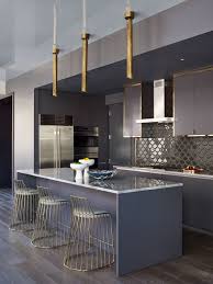 Stark white shaker cabinets and matte black hardware. 25 Beautiful Kitchens With Dark Backsplashes Dark Kitchen Backsplashes
