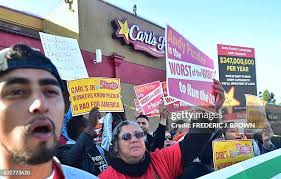 Isaiah Bryan Barfield holds a sign as he joins a protest against... News  Photo