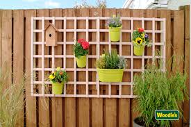 How To Create A Vertical Garden Woodie S In 2020 Vertical Garden Hanging Baskets Cuprinol Garden Shades