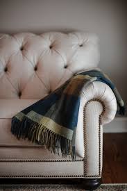 Features a portrait of billie eilish with a splash of neon green in her hair and shirt. Foxford Woollen Mills Blue Olive Brown Peacock Tartan Lambswool Throw Blanket Beautiful Linens