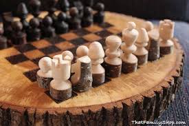 So instead only a thin layer of the lid will actually be the chess board. Log Slices Chiseled Into A Rustic Chess Board With Raw Pieces Wood Games Chess Board Chess Set