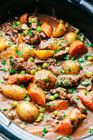 A Thick And Rich Sauce Filled With Hearty And Chunky Potatoes Carrots Onions And Peas With The Mos Slow Cooker Beef Stew Beef Stew Crockpot Slow Cooker Beef