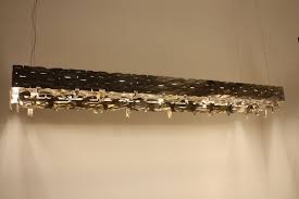 A recessed light bulb lies flush with the ceiling or other surface, making it nearly impossible to grab and unscrew it by hand. Rectangular Lighting Fixtures Add Geometric Dimension To Decor