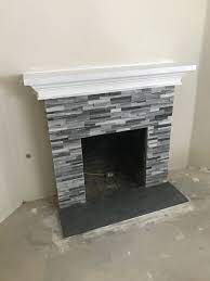 Black and white stone fireplace. Custom Grey Brick Fireplace Devoe Construction Design