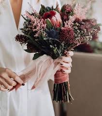 A refined dark wedding bouquet done with dark plum, hot pink and pink flowers, colored leaves and herbs for a boho wedding. 10 Stunning Autumn Wedding Bouquets You Ll Adore Weddingsonline Simple Wedding Bouquets Flower Bouquet Wedding Wedding Flowers