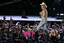 Kenny Chesney Brings Eagles Lombardi Trophy Onstage At