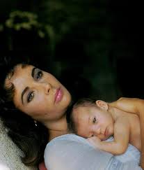Elizabeth Taylor with her baby daughter Liza Todd in 1957.