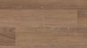The difference in luxury vinyl plank comes down to thickness, much like laminate flooring. Dakota Walnut Luxury Vinyl Plank Flooring Coretec Plus 5