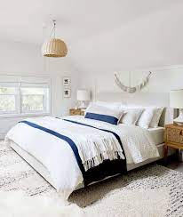 Grab the corner of the sheet that's hanging out at the foot of the bed, and fold that corner up until it's against the side of the mattress. The Right Way To Make Your Bed Our 5 Best Formulas Emily Henderson